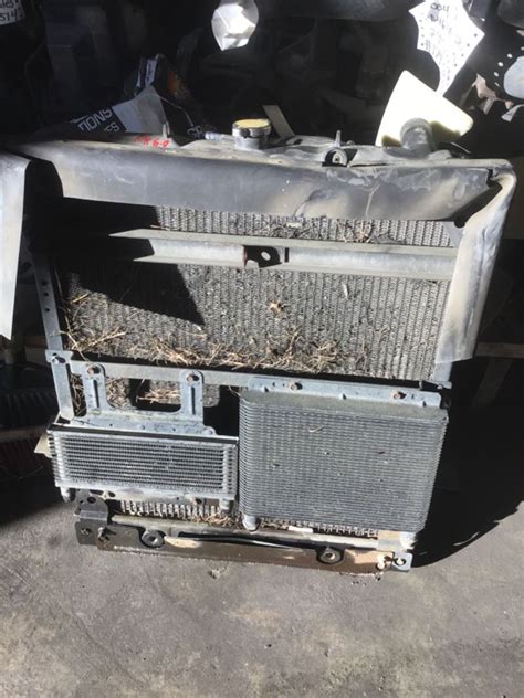 1999 skid steer isuzu 2.2l radiator used|2005 isuzu npr radiator.